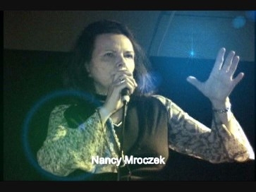 Dr. Nancy Mroczek singing.