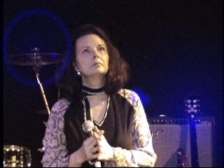 Dr. Nancy Mroczek holding a microphone.