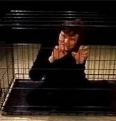 Dr. Nancy Mroczek in a cage.
